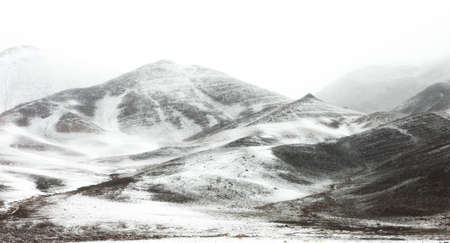 Snow and fog in the mountains of northern Mongoliaの写真素材