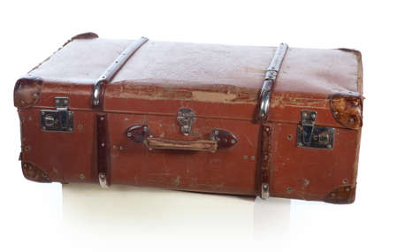 Old suitcase for traveling on a white backgroundの写真素材