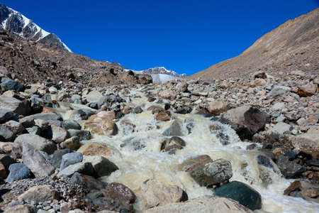 ice stream flowing from the glaciers of the mountain systemの写真素材