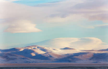 Morning sun in the winter mountainsの写真素材