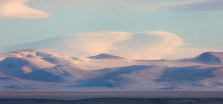 Morning sun in the winter mountainsの写真素材