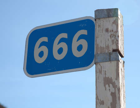 kilometer pole with a sign 666