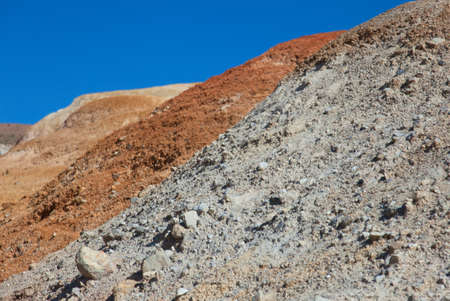 Red earth and blue sky in a wonderful location on the border of Altai and Mongoliaの写真素材