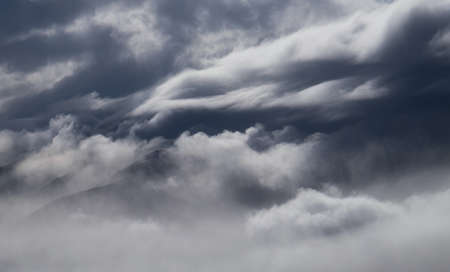 Cloudy weather in mountains, cloudy and fogの写真素材