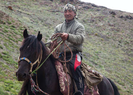 Mongoloid Man on a horse in the steppes of the Altai Mountainsのeditorial素材