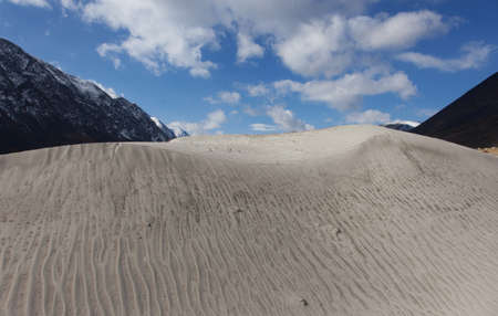 Dunes in the hills on the site of a mountain riverの写真素材
