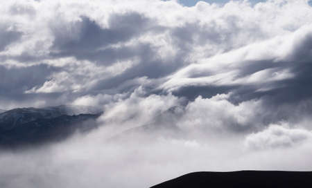 Cloudy weather in mountains, cloudy and fogの写真素材