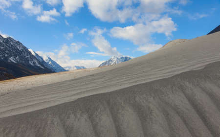 Dunes in the hills on the site of a mountain riverの写真素材
