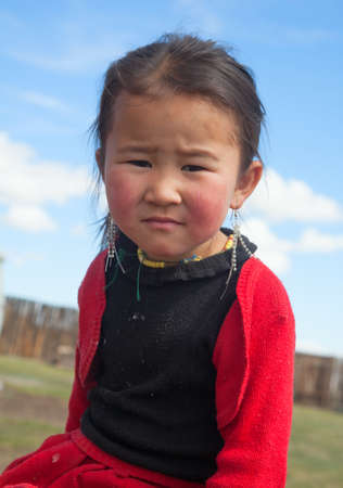 Portrait of a little girl living in the Altai mountains on the border of Mongoliaの写真素材