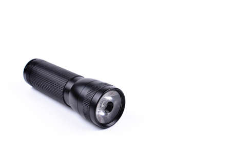 Black flashlight isolated on a white backgroundの写真素材