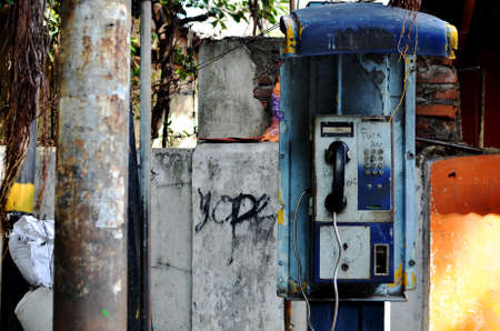 Abandoned payphone on old rustic wall in Tanah Abang, Jakarta