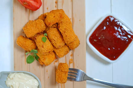 Fried fish nugget and sauceの写真素材
