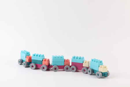 Plastic toy train on white background with copy space for text.の写真素材
