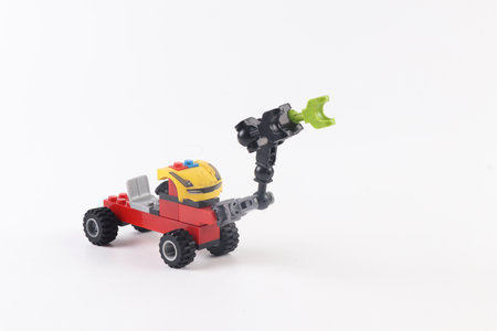 Lego robot minifigure on white background. Studio shot.