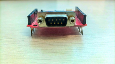 Front Perspective of a DB9 Male Serial Port Connector on a Red PCB Module for Industrial...