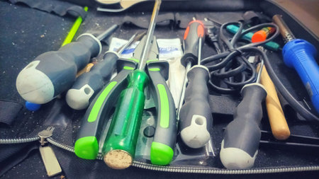 Side View of a Professional Hand Tool Kit Containing Screwdrivers and Accessories for Electronics...