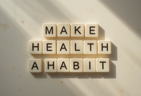 The image showcases letter blocks arranged to spell "Make Health a Habit," symbolizing motivation and commitment to a healthier lifestyle. Ideal for wellness themes.の素材