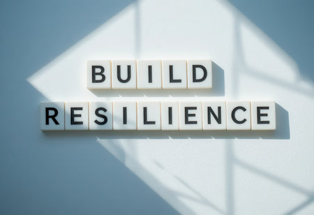An inspiring composition featuring the words "Build Resilience" crafted with letter tiles, emphasizing motivation and strength against challenges.の素材