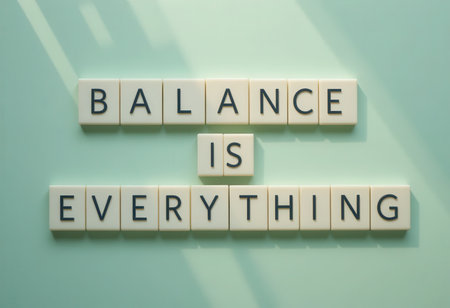 Inspirational quote about balance presented with letter blocks against a soft background. Perfect for wellness and motivational themes in various projects.の素材