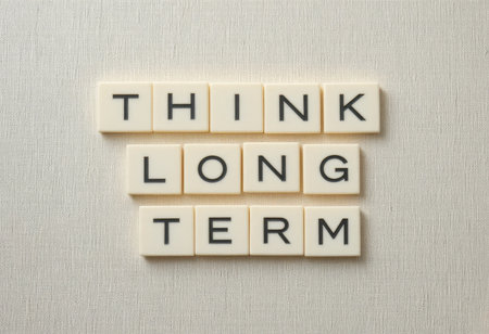 This image illustrates the concept of long term thinking using letter tiles arranged to communicate an important message. Perfect for business themes.の素材