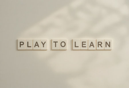This image features letter tiles spelling "Play to Learn" against a soft background, highlighting a creative approach to education and learning. Ideal for educational themes.の素材