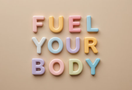 A visually appealing arrangement of colorful letters spelling "Fuel Your Body" on a soft, pastel background, promoting health and wellness in a playful and modern design.の素材