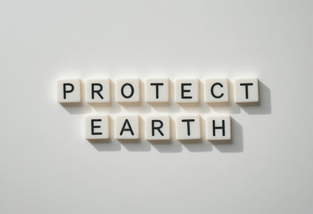 Letter blocks spell "Protect Earth" on a clean background, symbolizing the importance of environmental awareness and the need for sustainable action in daily life.の素材
