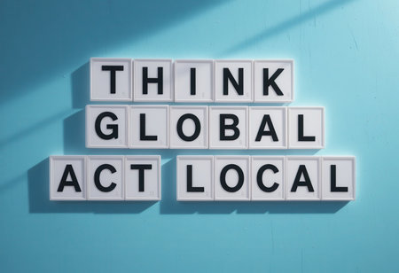 A motivational message displaying "Think Global Act Local" on a blue background. This inspiring text emphasizes the importance of local actions in a global context, promoting unity and sustainable development.の素材