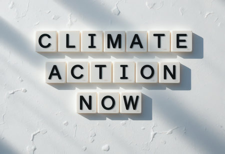 This image showcases a strong message of climate action using letter tiles. The clean white background enhances the emphasis on urgent environmental awareness and change.の素材