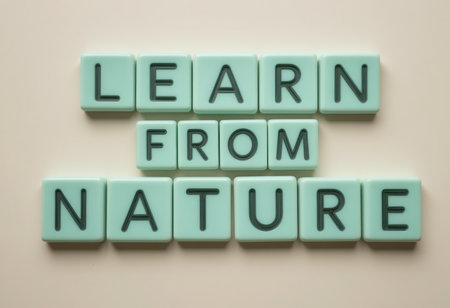 This image features green tiles arranged to spell "Learn from Nature," creating a motivational and calming visual. Perfect for nature-themed inspiration.の素材