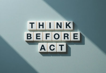A visually engaging image showcasing the phrase "Think Before Act" using letter tiles on a soft background, illuminated by subtle shadows. Ideal for promoting mindfulness and decision-making.の素材