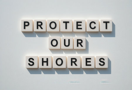 This creative image showcases a powerful message to protect our shores using letter tiles. It emphasizes the importance of environmental responsibility and conservation.の素材