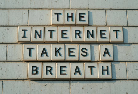 A creative display of letters forming the phrase "The Internet Takes a Breath." This unique wall art captures a playful message about modern digital life and connectivity.の素材
