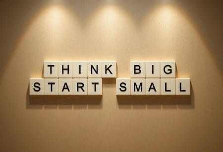 A motivational wall display featuring the phrase "Think Big Start Small." This image inspires individuals to embrace ambition while taking incremental steps toward success.の素材