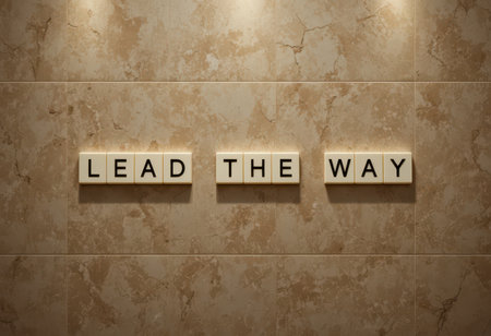 This image features a close-up of an inspiring wall art piece with the phrase "Lead the Way" against a warm, textured backdrop, perfect for modern interiors.の素材