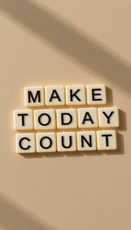 A motivational arrangement of letter tiles spelling "Make Today Count" on a neutral surface. Perfect for themes of positivity and self-improvement.の素材