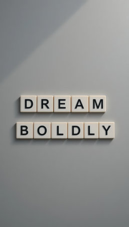 This image features the motivational phrase "Dream Boldly" arranged artistically on a gray background, perfect for inspiring creativity and ambition.の素材