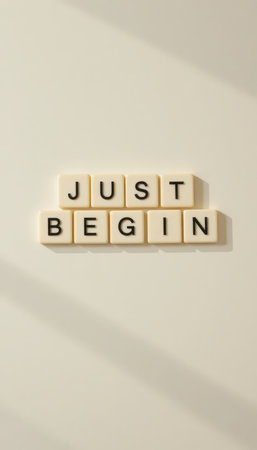 The image features letter blocks spelling "JUST BEGIN," symbolizing motivation and new beginnings. Perfect for themes of inspiration and self-improvement.の素材