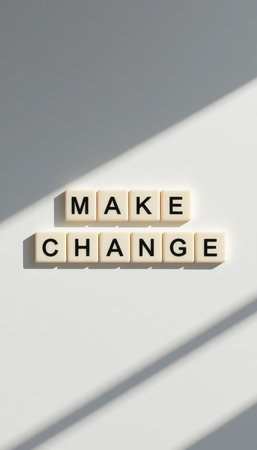 This image features the words "Make Change" arranged neatly, conveying a powerful motivational message. The minimalist design and shadows enhance the inspirational theme.の素材