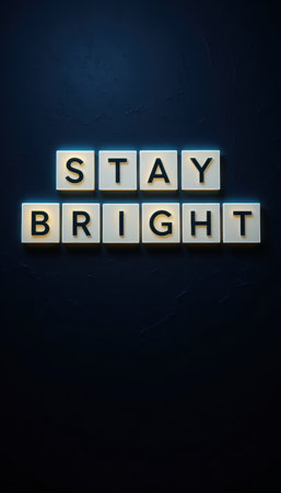 This image features the phrase "Stay Bright" displayed on a lightbox against a dark wall, conveying a powerful message of positivity and motivation for all settings.の素材