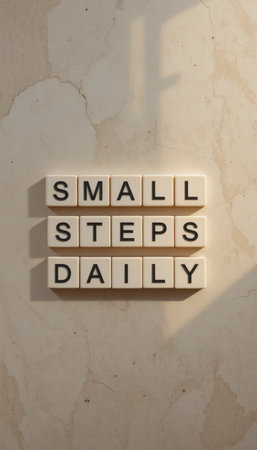 A motivational image showcasing the phrase "Small Steps Daily" in a modern style. Perfect for encouraging personal growth and consistent effort in achieving goals.の素材