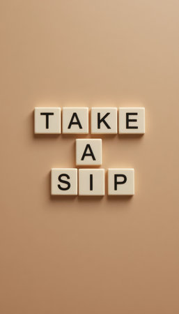 Creative arrangement of text "Take a Sip" on a soft beige background, ideal for beverage advertising, uplifting content, or decor in cafes.の素材
