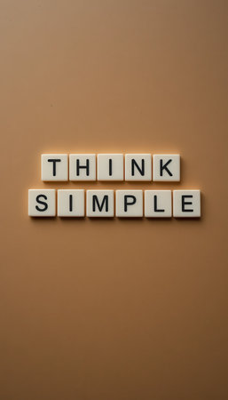 A motivational image showcasing the words "Think Simple" in a clear and modern typography on a warm brown background, ideal for promoting simplicity and clarity in thought.の素材