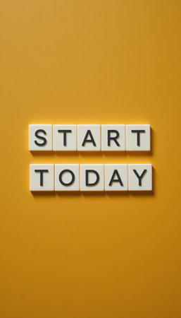 An inspiring composition showcasing letter tiles that highlight the motivational phrase "Start Today" against a vibrant yellow background, perfect for promoting action and positivity.の素材