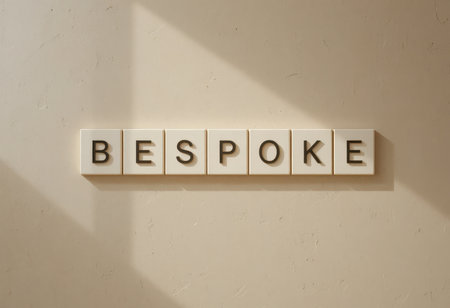 A minimalist image showcasing the word "Bespoke" made from letters arranged on a soft, neutral background, emphasizing creativity and personalized design.の素材