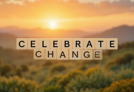 This inspirational image features the words "Celebrate Change" in letters against a beautiful sunset landscape, symbolizing growth and positivity. Perfect for motivational themes.の素材
