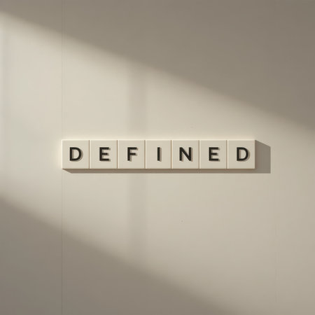 This minimalist artwork features the word "DEFINED" displayed in bold letters on a pristine white background, creating a striking contrast with soft shadows.の素材
