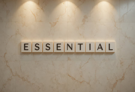A modern representation of the word "Essential" displayed on a wall, showcasing minimalist design and elegant lighting for impactful communication and decor.の素材