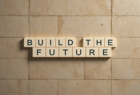 This image features the phrase "Build the Future" created with letter blocks on a textured stone wall. It represents creativity, vision, and motivation.の素材