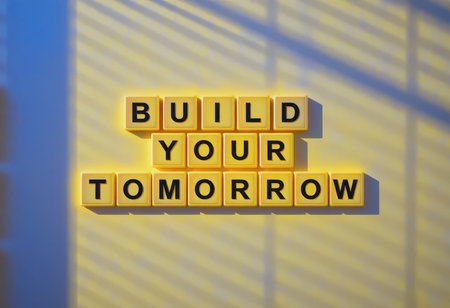 A vibrant arrangement of yellow blocks displaying the message "Build Your Tomorrow" emphasizes positivity and forward-thinking. Perfect for motivational projects.の素材